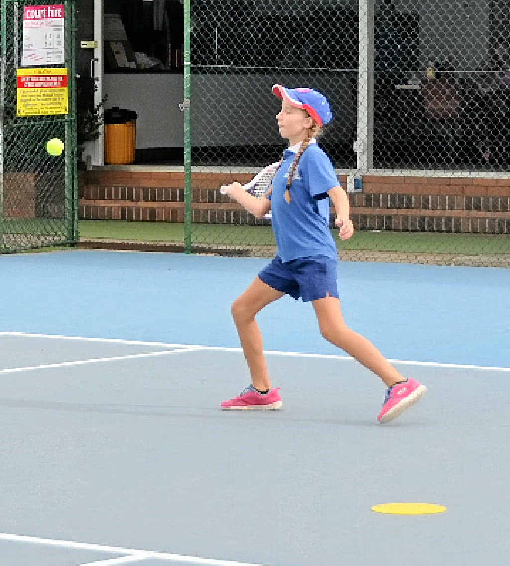 Christie Lyons hits a forehand yesterday.
